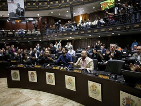 Opposition lawmakers shout "Fraud, fraud during a session of Venezuelan National Assembly in Caracas, Venezuela, Wednesday, Aug. 2, 2017.