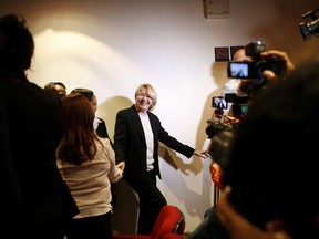 Venezuela's General Prosecutor Luisa Ortega Diaz greets employees and journalists after a news conference at her office in Caracas, Venezuela, Monday, July 31, 2017.  Diaz said Monday that the new assembly that is supposed to rewrite the constitution will put "absolute power" in the hands of a minority certain to abolish essential political rights like the freedom of expression. (AP Photo/Ariana Cubillos)