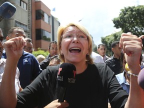Venezuelan General Prosecutor Luisa Ortega Diaz speaks to the media outside her office after security forces surrounded the entrance, in Caracas, Venezuela, Saturday, Aug. 5, 2017. Security forces surrounded the entrance ahead of a session of the newly-installed constitutional assembly in which the pro-government body is expected to debate Ortega Diaz's removal. (AP Photo/Wil Riera)