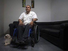 This Aug. 3, 2017 photo shows Javier Hernandez, a former employee of a state-run cement factory, during an interview at his home in Guatire Venezuela. Hernandez says he was fired along with 15 others for refusing to vote in last month's election of delegates for a constitutional assembly granting nearly unlimited powers to Venezuelan President Nicolas Maduro and his allies. "It was not a surprising measure, because we had been warned," Hernandez said. "The people who did not go to vote were explicitly threatened. ... If we didn't go to vote on 30th of July, we would be fired." (AP Photo/Wil Riera)