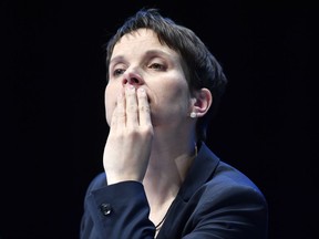 FILE- In this April 22, 2017 file photo Frauke Petry looks thoughtful at the party convention of Germany's nationalist party AfD (Alternative for Germany) in Cologne, Germany. A German state legislature has lifted the  prominent nationalist leader's immunity from prosecution, paving the way for a possible indictment over allegations she lied under oath.  (AP Photo/Martin Meissner, file)