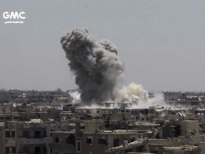 This frame grab from video provided on Sunday, Aug. 13, 2017, by the Ghouta Media Center, a Syrian activist media group, shows smoke and debris rising after a Syrian government ground-to-ground rocket strikes the opposition-held town of Ain Terma, in the Eastern Ghouta suburb of Damascus, Syria on Saturday. (Ghouta Media Center, via AP)