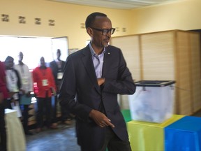 Rwandan President Paul Kagame arrives to cast his ballot in Rwanda's capital Kigali Friday Aug. 4, 2017 for the presidential elections in which he is widely expected to win another term after the government disqualified all but three candidates. (AP Photo/Jerome Delay)