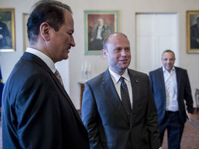 In this Friday, July 21, 2017 photo released by Malta Department of Information, Dubai based developer Damac chairman, Hussain Sajwani, left, meets with Malta Prime Minister Joseph Muscat, middle, in Malta. Hussain Sajwani met with leaders in the two European nations and addressed local journalists, many of whom referred to his ties to President Donald Trump or simply called him "the Donald of Dubai." (Malta Department of Information via AP)