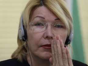 FILE - In this Aug. 23, 2017 file photo, Venezuela's ousted Chief Prosecutor Luisa Ortega Diaz attends a meeting of Mercosur trade bloc prosecutors, in Brasilia, Brazil. The chief prosecutor who was ousted by the Venezuelan government said on Monday, Aug. 28, 2017 from Costa Rica that the regime has tried to hire people to kill her. Ortega has been offered asylum in Colombia. (AP Photo/Eraldo Peres, File)