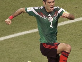 FILE - In this June 23, 2014 file photo, Mexico's Rafael Marquez celebrates scoring his side's first goal during the group A World Cup soccer match between Croatia and Mexico at the Arena Pernambuco in Recife, Brazil. The United States Treasury announced Wednesday, Aug. 9, 2017, that the legendary Mexican soccer player is among 22 people sanctioned for alleged ties to a drug trafficking organization. (AP Photo/Hassan Ammar, File)