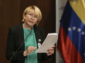 FILE - In this June 28, 2017 file photo, Venezuela's chief prosecutor Luisa Ortega speaks during a press conference in Caracas, Venezuela. The ousted chief prosecutor fled to Colombia with her husband German Ferrer, on Friday, Aug. 18, 2017, a day after the Supreme Court ordered his arrest. (AP Photo/Fernando Llano, File)