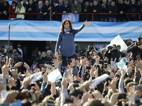 FILE - In this June 20, 2017 file photo, Argentina's former President Cristina Fernandez waves to supporters during a rally to launch her new political front Unidad Ciudadana or Citizens Unity Party, on the outskirts of Buenos Aires, Argentina. Contrary to pollsters predictions, Fernandez, who is running for a Senate seat, was not able to surpass her opponent, but tied with the ruling party candidate in the Sunday, Aug. 13, 2017 primary. (AP Photo/Victor R. Caivano, File)