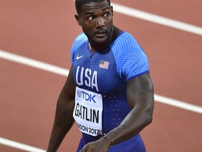 United States' Justin Gatlin reacts after his heat in the Men's 100 meters during the World Athletics Championships in London Friday, Aug. 4, 2017. (AP Photo/Martin Meissner)