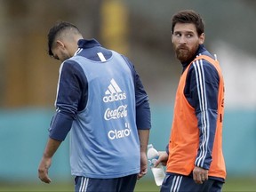 Argentina's Lionel Messi, right, and Sergio Aguero leave after a training session in preparation for an upcoming 2018 Russia World Cup qualifying soccer match against Uruguay, in Buenos Aires, Argentina, Monday, Aug. 28, 2017. (AP Photo/Natacha Pisarenko)