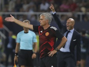 Manchester United's coach Jose Mourinho second right, gives instructions to his players l during Real Madrid's Karim Benzema the UEFA Super Cup final soccer match between Real Madrid and Manchester United at Philip II Arena in Skopje, Tuesday, Aug. 8, 2017. (AP Photo/Boris Grdanoski)