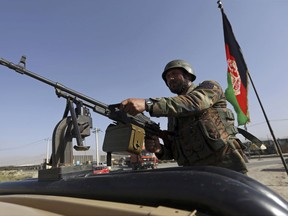 An Afghan National army soldier stands guard a checkpoint on the outskirts of Kabul, Afghanistan, Monday, Aug. 21, 2017. On Monday, President Donald Trump is planning to deliver his first formal address to the nation since taking office as he reveals to the nation his strategy for the war in Afghanistan. (AP Photo/Rahmat Gul)