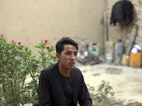 In this Tuesday, Aug. 1, 2017 photo, Mohammad Reza Rafat, 18, who received the highest score among thousands of students in this year's university entrance exam, speaks during an interview with The Associated Press in Kabul, Afghanistan. Despite 16 years of war and billions of dollars in international aid, security is worsening, jobs have grown scarce and especially young Afghans see opportunities dwindle. (AP Photo/Rahmat Gul)