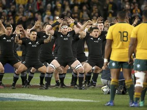 The New Zealand team, left, perform the "haka," their traditional challenge, as Australian players watch before their during their rugby union test match in Sydney, Saturday Aug. 19, 2017. (AP Photo/Rick Rycroft)