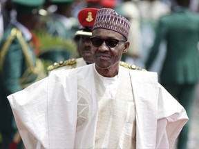 FILE- In this file photo taken Friday, May 29, 2015, Nigerian President elect, Muhammadu Buhari, arrives for his Inauguration at the eagle square in Abuja, Nigeria. Nigerian President Muhammadu Buhari will return to the country Saturday Aug. 19, 2017 after more than three months in London for medical treatment, his office announced, while giving no details on what exactly has been ailing him. (AP Photo/Sunday Alamba, File)