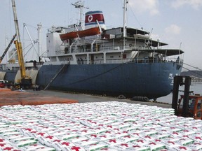 In this May 23, 2005, file photo, a North Korea cargo ship Paik Du San cast anchor as the bags of fertilizer are loading its at Ulsan port in Ulsan, South Korea. North Korea has been condemned and sanctioned for its nuclear ambitions, yet has still received food, fuel and other aid from its neighbors and adversaries for decades. How does the small, isolated country keep getting what it wants and needs to prevent its collapse? (AP Photo/ Lee Jin-man, File)