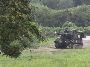 U.S. Army's Paladin self-propelled howitzer is seen near the border in Paju, South Korea, Thursday, Aug. 10, 2017. North Korea on Thursday announced a detailed plan to launch a volley of ballistic missiles toward the U.S. Pacific territory of Guam, a major military hub and home to U.S. bombers, and dismissed President Donald Trump's threats of "fire and fury" if it doesn't back down. (Im Byung-shik/Yonhap via AP)