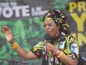 Zimbabwe's first lady, Grace Mugabe, addresses party supporters at a ZANU PF Rally in Chinhoyi, Zimbabwe, in this Saturday July 29, 2017 photo. Accused of assaulting a woman in a Johannesburg hotel, the wife of Zimbabwean President, Robert Mugabe, is a fiery character with outsized political ambitions who describes herself as the "mother of the nation" and whose scoldings of top figures in her husband's government earned her the nickname, "Dr Stop It." (AP Photo/Tsvangirayi Mukwazhi)