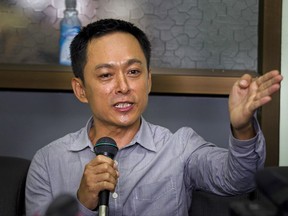 Kyaw Min Swe, chief editor of The Voice Daily local newspaper, talks to media during a press briefing, Friday, Aug. 4, 2017, in Yangon, Myanmar. Myanmar's court granted bail to Min Swe on Friday after he was arrested in June along with the columnist Kyaw Zwa Naing on June 2 for publishing a satirical printed article, that allegedly mocked and questioned the country's military on its efforts to reach a peace agreement with ethnic minority groups. (AP Photo/Thein Zaw)