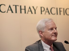 Cathay Pacific Chairman John Slosar attends a news conference as he announces the company result in Hong Kong, Wednesday, Aug. 16, 2017. Hong Kong airline Cathay Pacific is reporting that it swung into a loss for the first half as fierce competition from rivals took a further toll. The airline said Wednesday that it lost 2.1 billion Hong Kong dollars ($262 million) in the first six months of the year, compared with a HK$353 million profit from the previous year.(AP Photo/Vincent Yu)