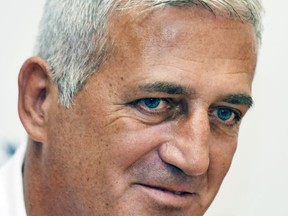 Swiss national soccer team head coach Vladimir Petkovic smiles during a press conference in Feusisberg, Switzerland, Monday, Aug. 28, 2017. Switzerland coach Vladimir Petkovic has signed a two-year contract extension as reward for a perfect record in World Cup qualifying. The Swiss football federation says Petkovic was contacted by clubs after the team's rise to No. 4 in the FIFA rankings. The statement did not identify clubs wanting to hire Petkovic.  (Walter Bieri/Keystone via AP)