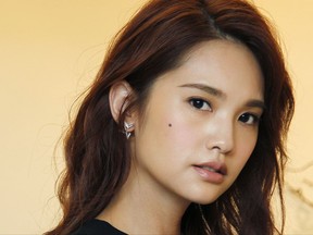 In this photo taken on Saturday, Aug. 5, 2017, Taiwanese actress Rainie Yang poses during an interview with The Associated Press in Taipei, Taiwan. Yang stars in "The Tag Along 2," a sequel to the 2015 hit that's loosely based on a ghostly urban legend in Taiwan about a little girl that appears in the footage of a family's hiking trip. (AP Photo/Chiang Ying-ying)