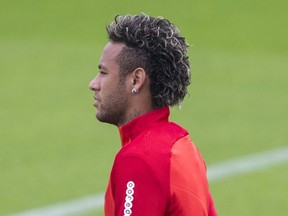 Paris Saint-Germain's Brazilian soccer star Neymar arrives for a training session  at the Camp des Loges training center in Saint Germain en Laye, west of Paris, Friday, Aug. 11, 2017. (AP Photo/Kamil Zihnioglu)