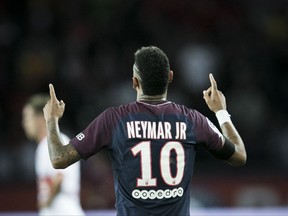 PSG's Neymar celebrates after scoring against Toulouse during the French League One soccer match between PSG and Toulouse at the Parc des Princes stadium in Paris, France, Sunday, Aug. 20, 2017. (AP Photo/Kamil Zihnioglu)