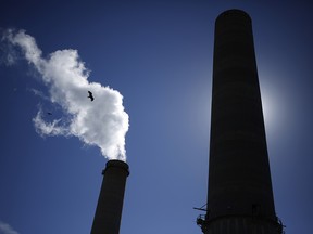 Water vapor rises from the NRG Energy Inc. WA Parish generating station in Thompsons, Texas, U.S., on Thursday, Feb. 16, 2017.