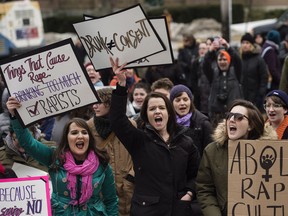 Demonstrators protest Judge Gregory Lenehan's decision to acquit a Halifax taxi driver charged with sexual assault during a rally in Halifax on Tuesday, March 7, 2017