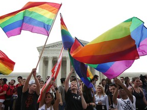 Same-sex marriage supporters rejoice after the U.S Supreme Court hands down a ruling regarding same-sex marriage June 26, 2015