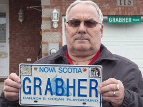 Lorne Grabher displays his personalized licence plate in Dartmouth, N.S. on Friday, March 24, 2017. A legal battle over whether Nova Scotia violated the constitution when it decided a man's personalized licence plate was offensive to women is expected before the courts on Wednesday.