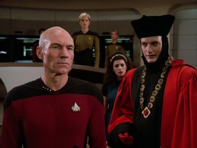 Patrick Stewart as Captain Jean-Luc Picard, (R) John de Lancie as Q, (Back right) Marina Sirtis as Counselor Deanna Troi and (back center) Denise Crosby as Lieutenant Tasha Yar in the first episode of Star Trek: The Next Generation called Encounter at Farpoint from 1987.