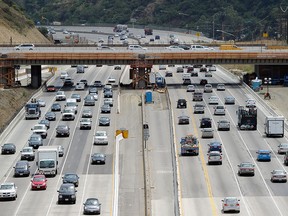 Traffic flows under the Mulholland Bridge on Interstate 405 on July 7, 2011 in Los Angeles, California.