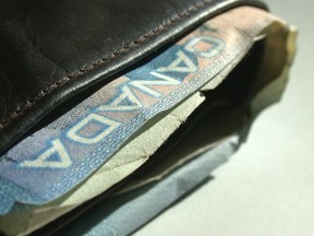 FOR NATIONAL POST USE ONLY - NO POSTMEDIA - Close-up of a wallet with a five dollar Canadian bank note, 5 dollar bill. Credit: Getty/Thinkstock.