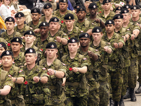 Members of 32 Canadian Brigade Group march in 2004. The problem for the reserves is that, while the militia is probably one of the most ethnically and racially diverse organizations in Canada, only about 15% of the Canadian Forces over all are women, Christie Blatchford writes.