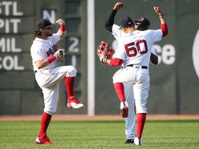 New York Yankees v Boston Red Sox

BOSTON, MA - AUGUST 20:  Andrew Benintendi #16, Mookie Betts #50 and Jackie Bradley Jr. #19 of the Boston Red Sox react after the victory over the New York Yankees at Fenway Park on August 20, 2017 in Boston, Massachusetts.  (Photo by Adam Glanzman/Getty Images)

No more than 7 images from any single MLB game, workout, activity or event may be used (including online and on apps) while that game, activity or event is in progress.
Adam Glanzman, Getty Images