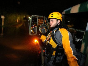Joshua Alicea, a member of a rescue team from the local emergency management agency inspects flooded areas after the passing of Hurricane Irma on September 6, 2017 in Fajardo, Puerto Rico. The category 5 storm is expected to pass over Puerto Rico and the Virgin Islands today, and make landfall in Florida by the weekend.