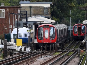 A forensic tent is seen next to the stopped tube train at Parsons Green Underground Station on September 15, 2017 in London, England.