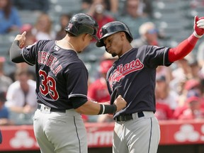 Francisco Lindor and Giovanny Urshela of the Cleveland Indians celebrate after both score on Lindor's three-run home run on Sept. 21, 2017.