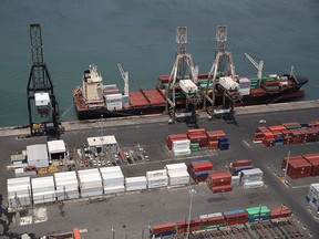 A container ship is seen docked at the port of San Juan as people deal with the aftermath of Hurricane Maria on September 25, 2017 in San Juan Puerto Rico.