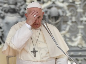 Pope Francis prays during his weekly general audience at St Peter's square on August 30, 2017 in Vatican.