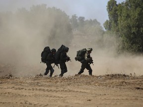Israeli soldiers take part in a military exercise simulating conflict with Lebanese movement Hezbollah, in the Israeli annexed Golan Heights, near the Syrian border on September 5, 2017