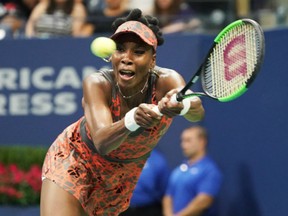 Venus Williams of the U.S. returns the ball to the Czech Republic's Petra Kvitova during their U.S. Open women's quarter-final match in New York on Tuesday night. Williams won the match 6-3, 3-6, 7-6 (2).