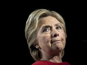 This file photo taken on November 07, 2016 shows former Democratic presidential nominee Hillary Clinton pausing while speaking during a rally at the Grand Valley State University Fieldhouse in Allendale, Michigan.