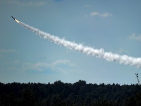 An air defence system missile flies towards a mock enemy target during the joint Russian-Belarusian military exercises Zapad-2017 (West-2017) at a training ground near the village of Volka, some 200 km southwest of Minsk, on September 19, 2017.