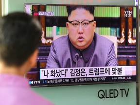 A man watches a television news screen showing a picture of North Korean leader Kim Jong-Un delivering a statement in Pyongyang, at a railway station in Seoul on September 22, 2017.