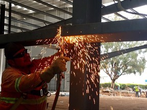 A worker welds pieces for the latest expansion of a plant in San Juan Del Rio, Mexico, owned by Canadian auto-parts company Exo-S, on Saturday, Sept. 2, 2017.