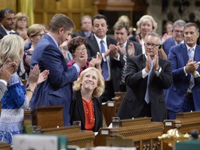 Conservative MP Lisa Raitt is applauded after giving a statement on Alzheimer's disease before question period in the House of Commons on Parliament Hill in Ottawa on Tuesday, Sept.26, 2017. THE CANADIAN PRESS/Adrian Wyld