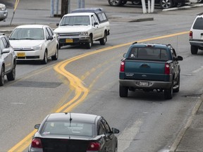 This Friday, Sept. 22, 2017, photo shows how new dividing lines on the Tongass Highway in Ketchikan, Alaska are crooked, and the paint that's been used by state transportation officials has stained cars, officials said. (Taylor Balkom/Ketchikan Daily News via AP)